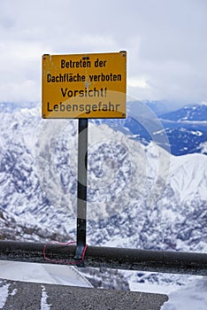 Warning sign on top of mountain