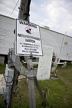 Warning sign in yard after Hurricane Katrina