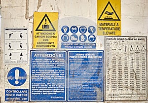 Warning signs in a closed factory in Italy photo
