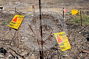 Warning signs with Danger Mines