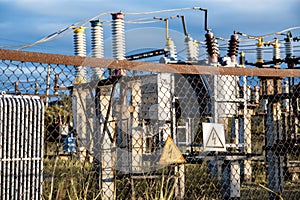 Warning signs of electrical hazard on fence