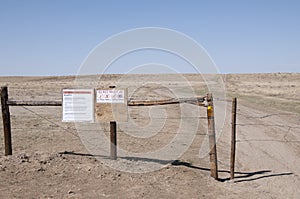 Warning signs on fence gate
