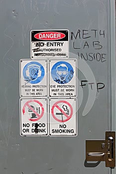 Warning Signs with graffiti