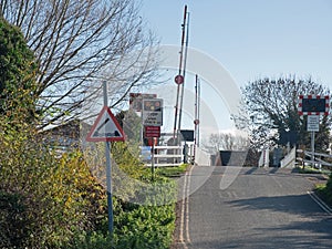 Warning signs and instructions on a road approaching an English canal