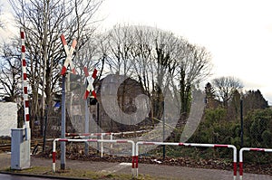 Warning signs and lamps with barrier at railroad crossing