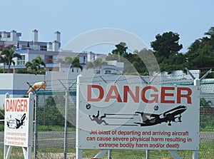 Warning signs at Princess Juliana International Airport in Sint Maarten photo