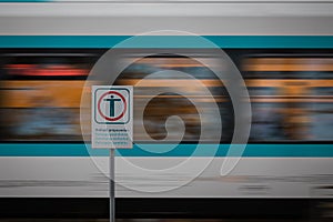 Warning signs for prohibited passage over railway tracks. Metal board for train crossing safety while the train is passing by