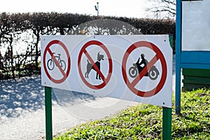 Warning Signs prohibiting bike, motorcycle and dog walking