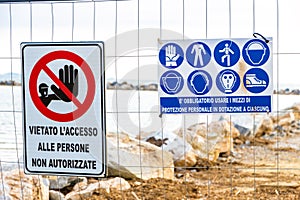 Warning signs on the shoreline in Follonica, Italy