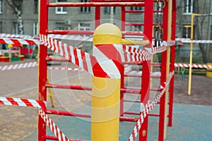 Warning tape on closed playground, quarantine concept