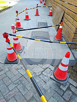 Warning triangle cones placed for road construction work.