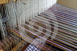 Warp threads in weaving loom close-up