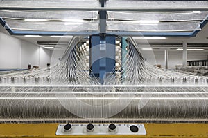 Warping machine in a textile weaving factory