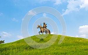 Warrior Bhai Baaj Singh statue sitting on horse against sky in the background. park and outdoor concept