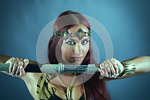 Warrior woman holding sword in her hand