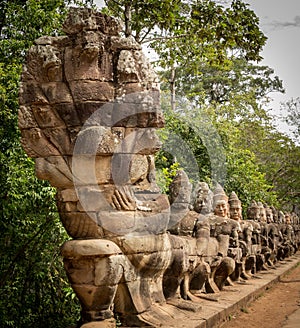 Warriors line entrance to south gate angkor thom