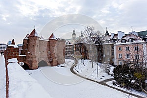 Warsaw Barbacan fortress castle in winter is in the capital city of Poland. Old town is the historic center of Warsaw