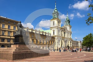 Warsaw, Poland - Front view of the baroque Holy Cross Church and the Mikolaj Kopernik statue, at the Krakowskie Przedmiescie