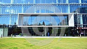 Architectural fragment of the entrance of the modern office building in Mokotow district.