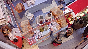 WARSAW, POLAND - DECEMBER, 18, 2016. Christmas bazar booth with bread and cucumber sandwiches. Top view