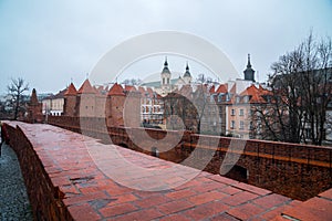 Warsaw, Poland Famous Barbican old town historic capital city during rainy winter day and red orange brick wall fortress