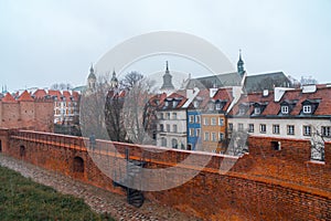 Warsaw, Poland Famous Barbican old town historic capital city during rainy winter day and red orange brick wall fortress