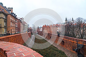 Warsaw, Poland Famous Barbican old town historic capital city during rainy winter day and red orange brick wall fortress