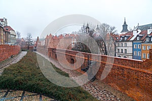 Warsaw, Poland Famous Barbican old town historic capital city during rainy winter day and red orange brick wall fortress