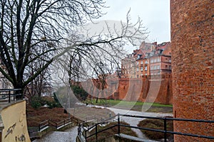 Warsaw, Poland Famous Barbican old town historic capital city during rainy winter day and red orange brick wall fortress