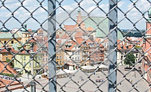 WARSAW, POLAND - JUNE 16: Castle Square view through iron fence
