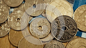 Warsaw, Poland 01.01.2021 Norwegian kroner coins above one to hundre kroner ( 200 kroner) banknote, extreme close up
