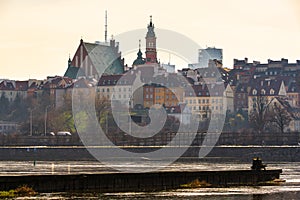 Warsaw, Poland - panorama of a city skyline and Old Town. Cityscape view of Warsaw with skyscrapers. Sunny day over the river