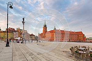 Warsaw, Poland - September 5, 2018: People on the Royal Castle square in Warsaw city at sunset, Poland. Warsaw is the capital and