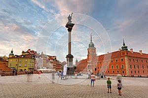 Warsaw, Poland - September 5, 2018: People on the Royal Castle square in Warsaw city at sunset, Poland. Warsaw is the capital and