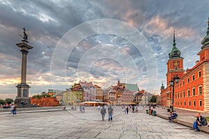 Warsaw, Poland - September 5, 2018: People on the Royal Castle square in Warsaw city at sunset, Poland. Warsaw is the capital and