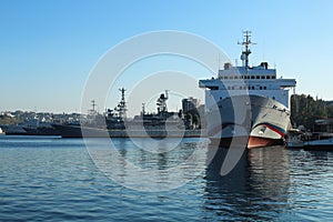 Warships and civilian ships at the port marina