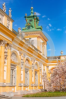 Warszawa, Poland - April 18: Focus on View of the central facade of the Royal Wilanow Palace. Spring in the park