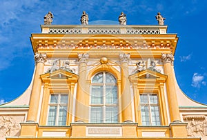 Warszawa, Poland - April 18: Focus on View of the central facade of the Royal Wilanow Palace. Spring in the park