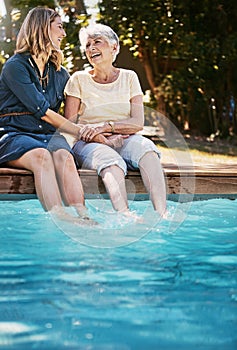 This was a lovely idea, thank you. a happy senior woman spending quality time with her daughter at the pool.