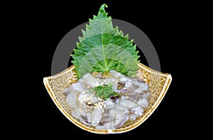 Wasabi pickled squid with oba leaves in a tile bowl photo