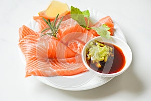 Wasabi sauce raw salmon filet on white plate - Fresh salmon fish for cooking salad seafood japanese food