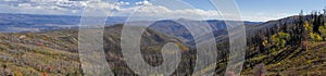 Wasatch mountain range with burnt trees during wild fires in Utah