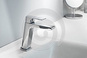 Washbasin tap in close photo