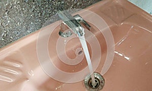 Wash Basin tap, personal hygiene hand wash, water flowing,