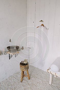 Wash basin vintage. Retro stoned sink. romantic vintage bathroom interior. Design loft  with wood and concrete.