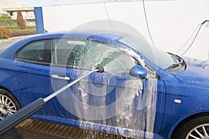 Wash a car in carwash with water