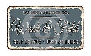 Wash and fold vintage rusty metal sign