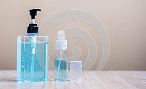 Wash hand alcohol gel and spray or sanitizer bottle on wooden table background, prevent coronavirus or Corona Virus Disease.