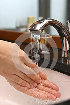 Wash hand at sink