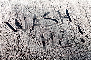 Wash Me Words on a Dirty Car Window photo